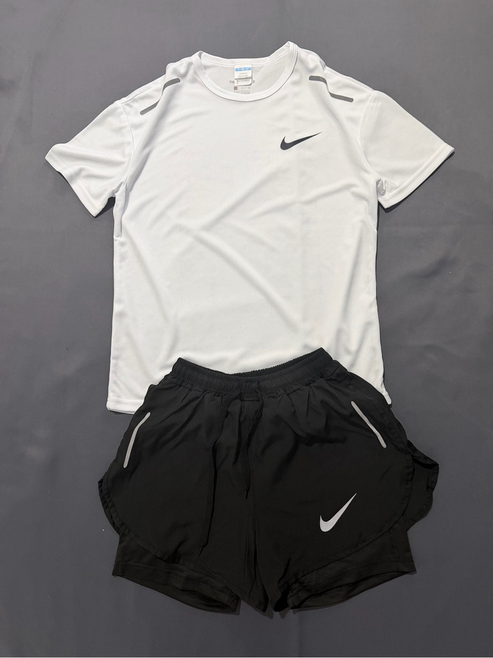 On Running Men’s White Performance Tee and Black Athletic Shorts Set